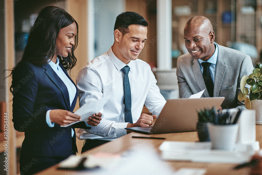 Diverse group of smiling businesspeople working in an office
